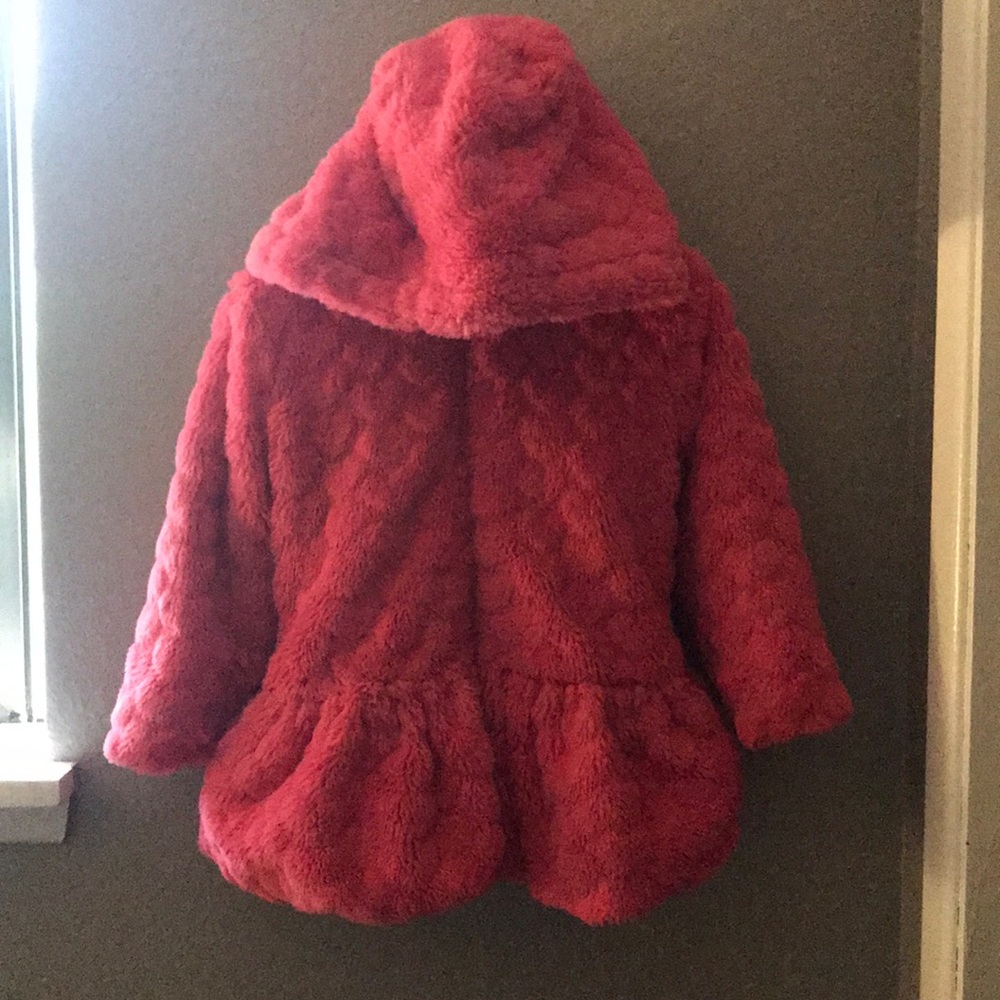 Bright pink faux fur coat